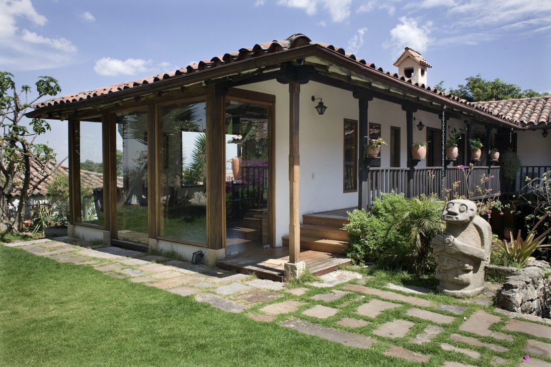 Professor Adrian Cussins' colonial house in La Candelaria with terracotta roof tiles, wooden beams and manicured garden.