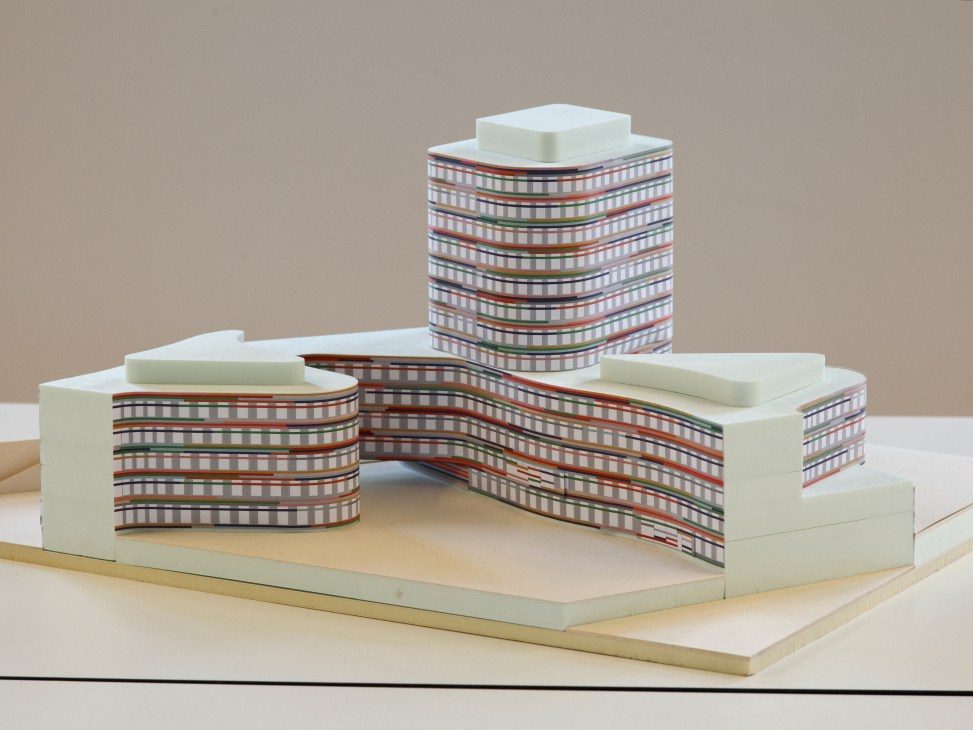 Architectural model of BSU Hamburg showing curved structures with colorful striped facades and cream-colored roof elements.