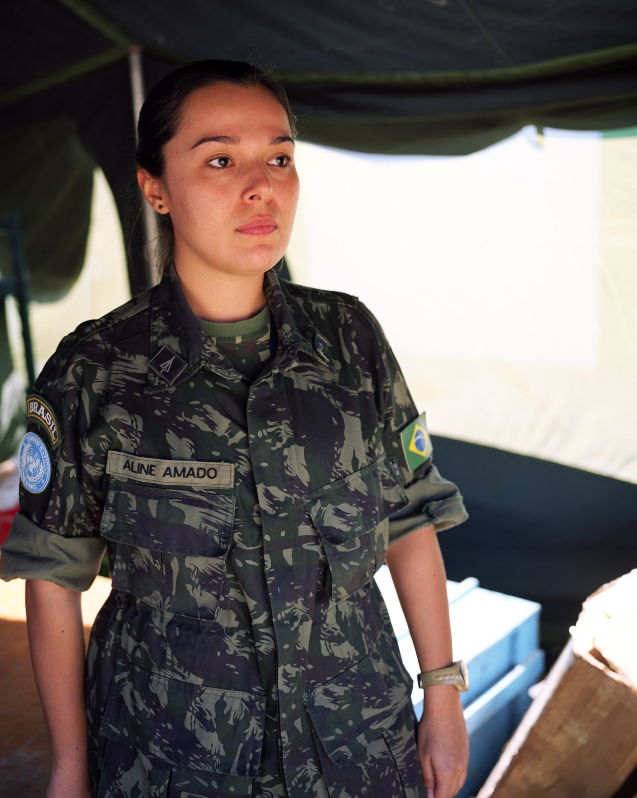 First Lieutenant Aline Amado wearing Brazilian military camouflage uniform with name tape visible on chest.