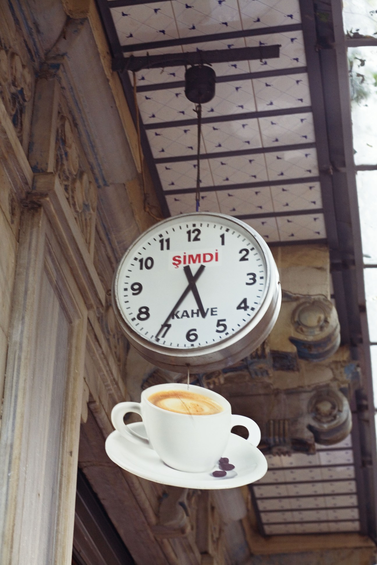 Simdi Café sign with clock and coffee cup in Istanbul