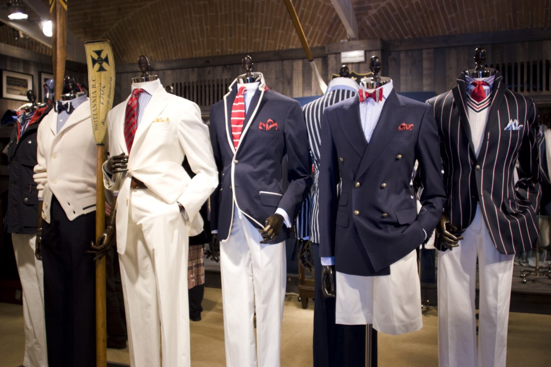 Hackett menswear display featuring mannequins in blazers and formal wear with striped and patterned shirts in nautical-inspired colors.