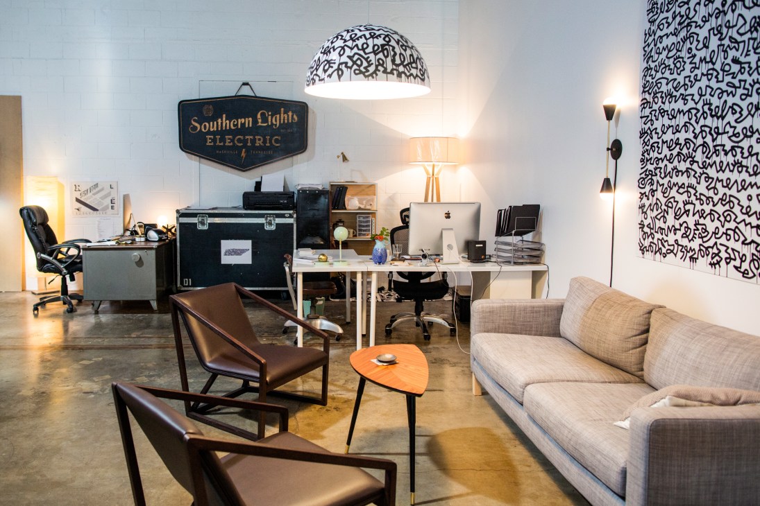 Southern Lights Electric Co office interior with pendant lighting, furnishings and signage at the Weld creative space.