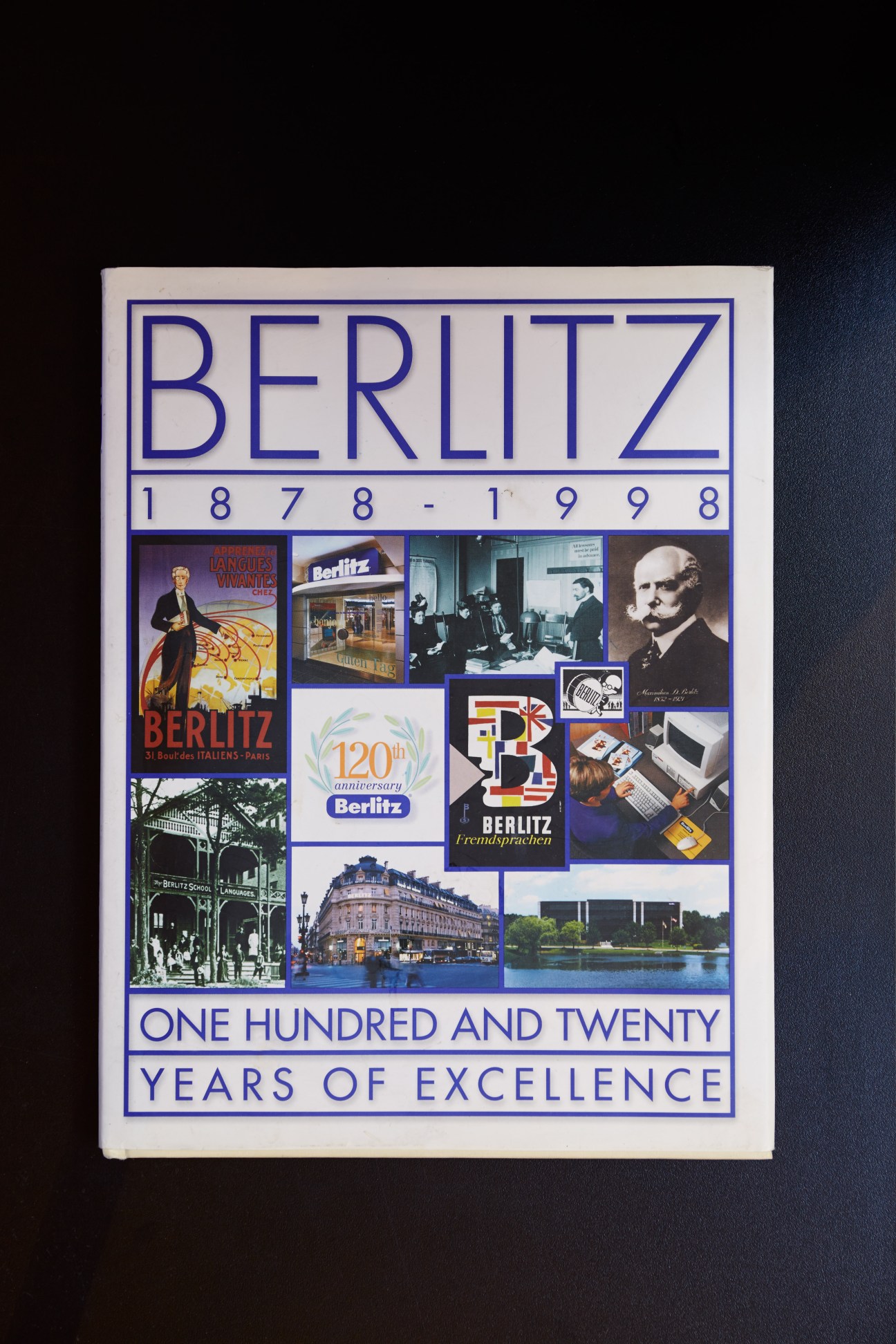 Berlitz history book cover featuring the company's blue logo, dates 1878-1998, and collage of vintage photographs and advertisements.