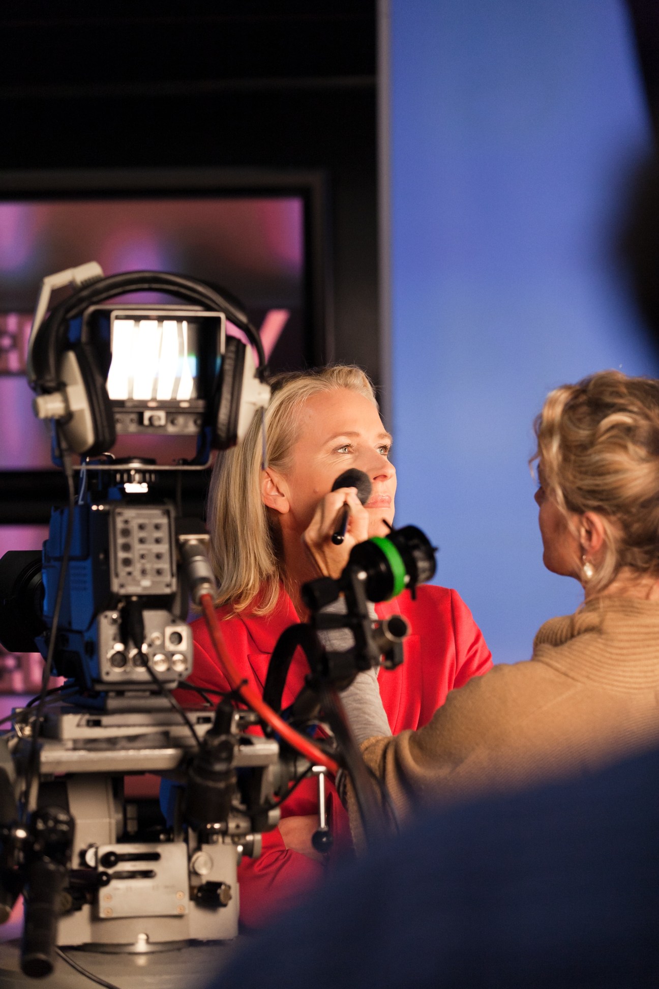Der Spiegel TV anchor Maria Gresz applies makeup before filming at a television studio.