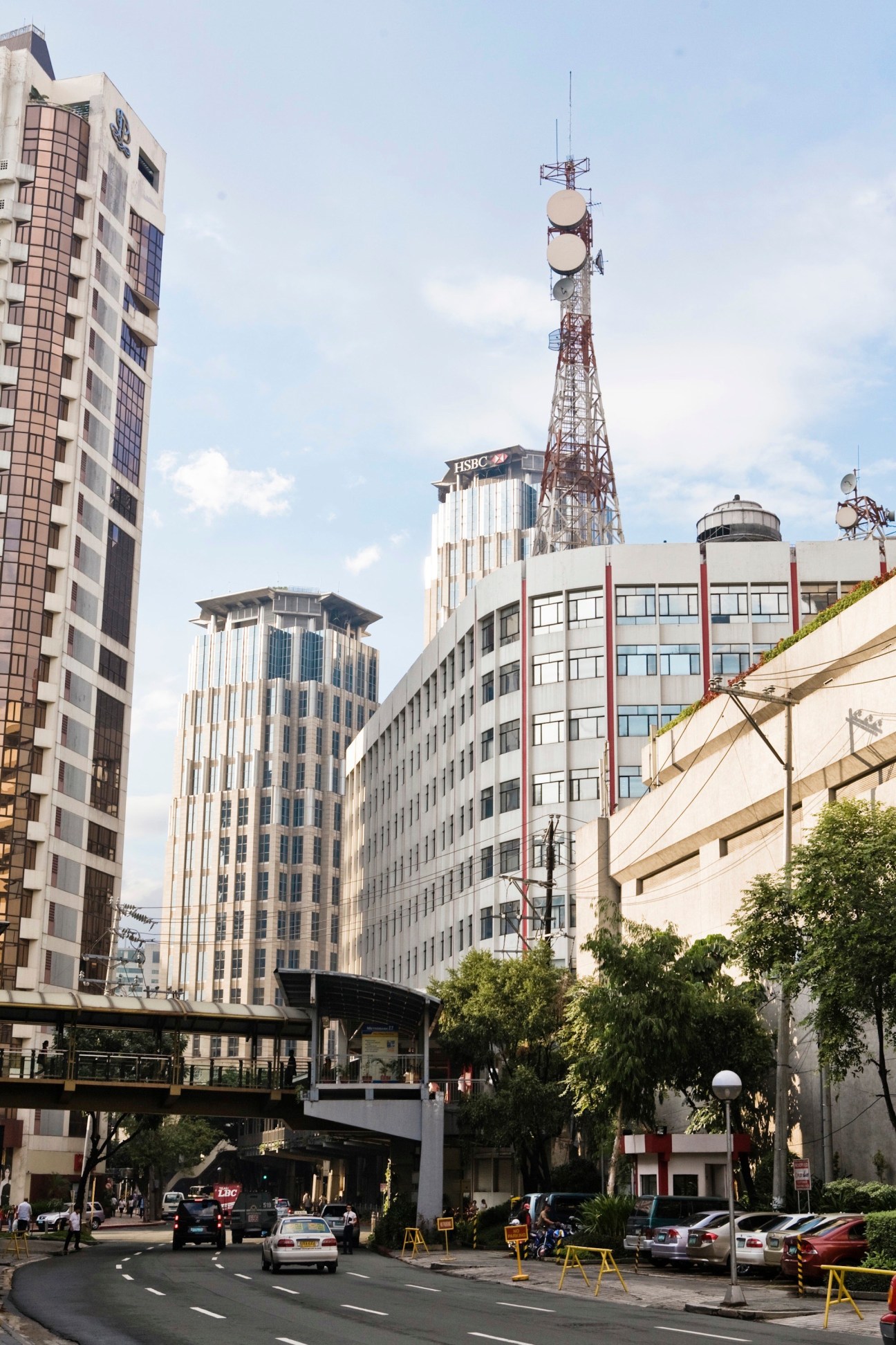 Modern high-rise buildings and communication tower in Makati district of Manila.