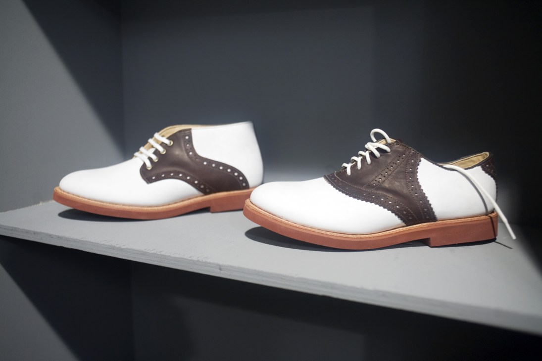 Two-tone white and brown suede oxford shoes with contrast brogue detailing and tan leather soles.