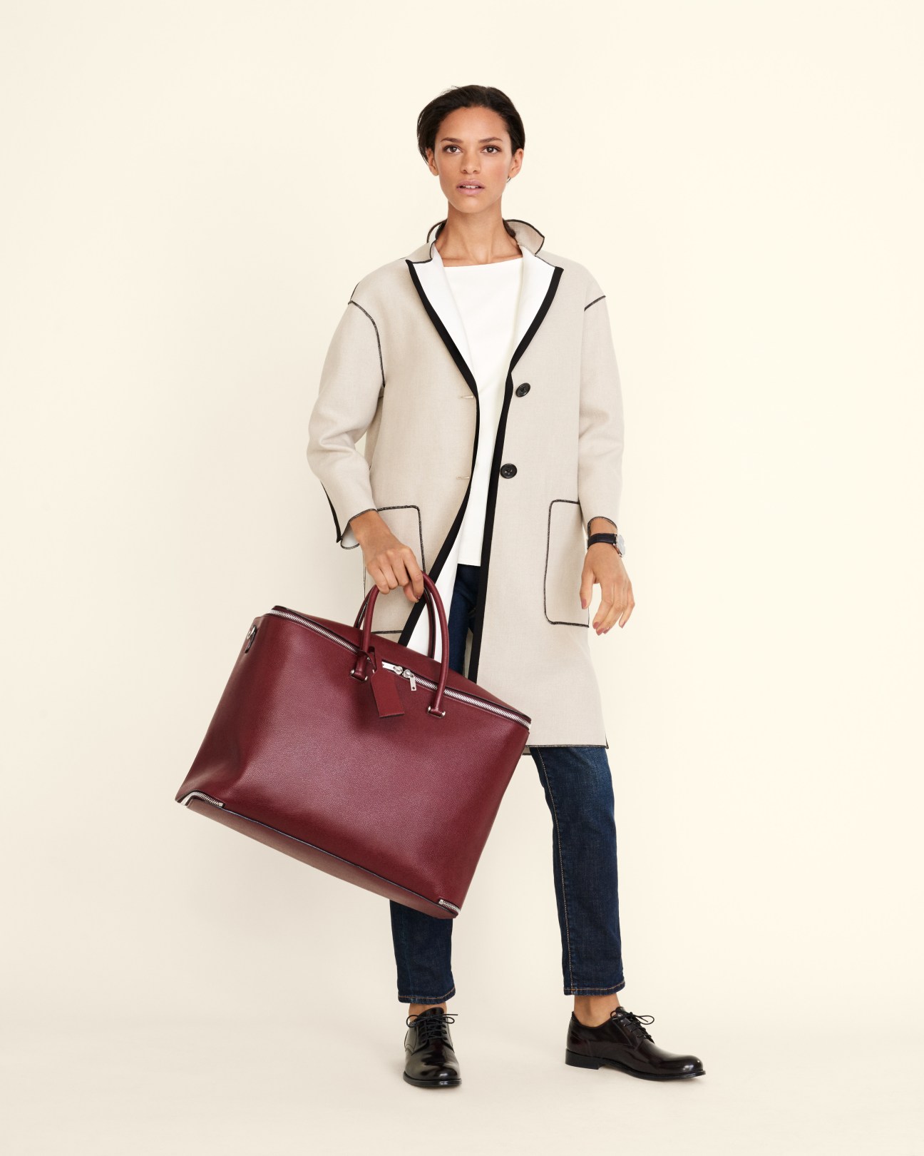 Model wearing Agnona coat, Cos pullover, Roy Roger's jeans, GH Bass shoes, Hermès watch and Valextra bag.