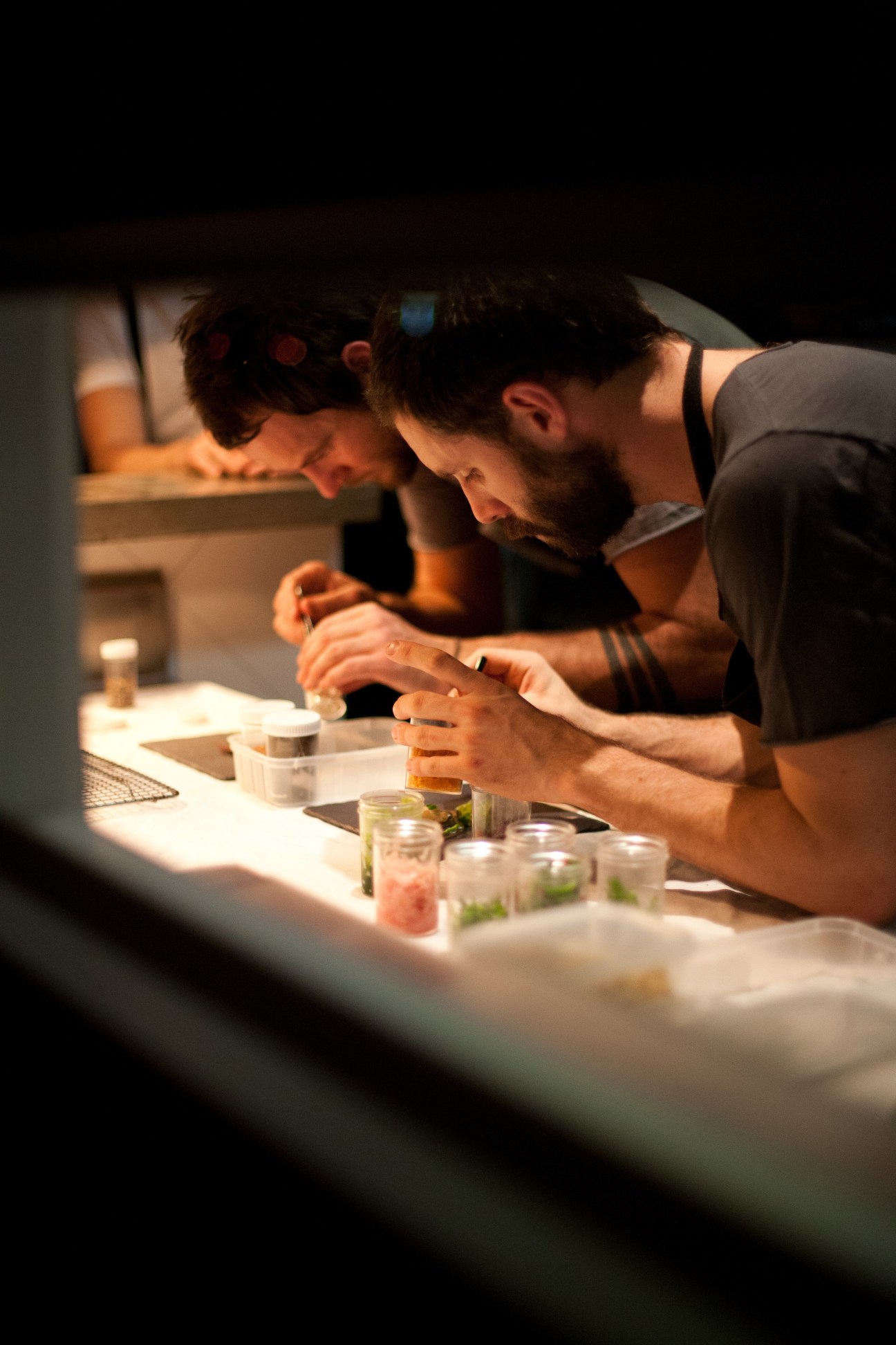 Two chefs plating dishes at The Brix restaurant in Melbourne.