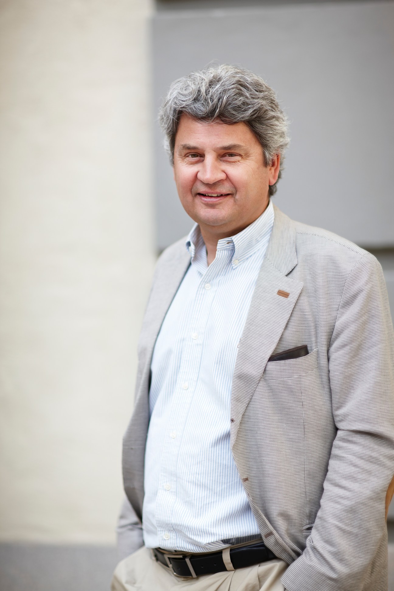 Portrait of Örjan Sölvell, director of the Center for Strategy and Competitiveness in Stockholm, smiling at camera.