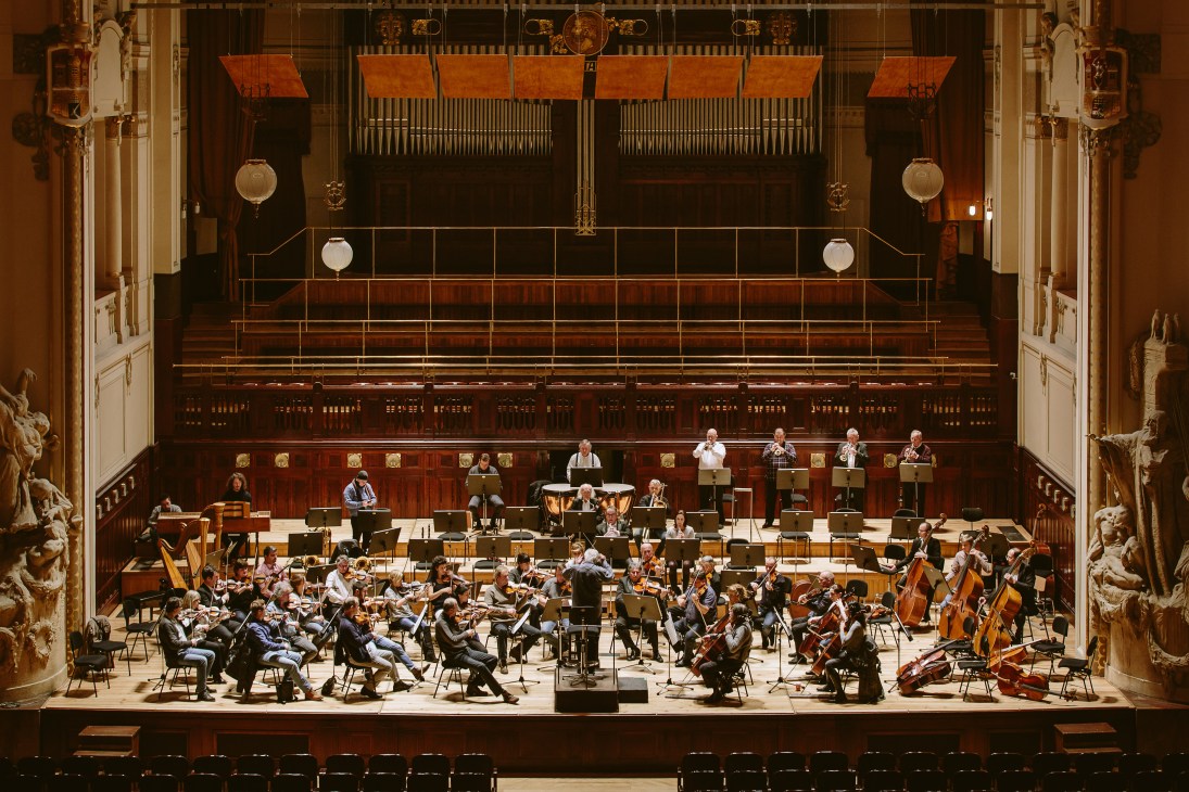 Orchestra with conductor Libor Pesek during final rehearsal in ornate concert hall