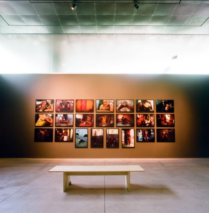 Gallery wall displaying multiple framed photographs by Brazilian artist Miguel Rio Branco at Inhotim art centre