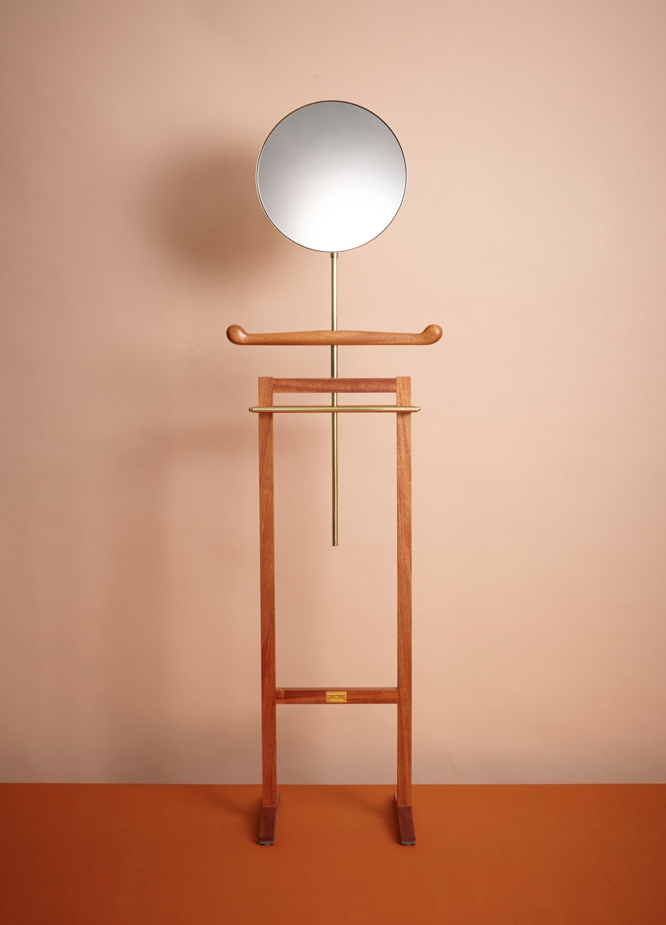 Bellhop butler coat stand by Michael Anastassiades for Svenskt Tenn with circular mirror, wooden arms and mahogany frame.