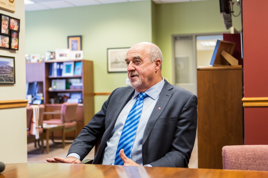 Mayor of Thunder Bay, Keith Hobbs, gestures while speaking in an office setting.