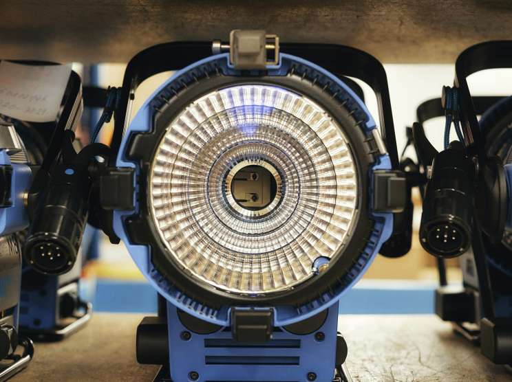 Close-up of an Arri D5 cinema lighting fixture showing its internal light source and reflective components.