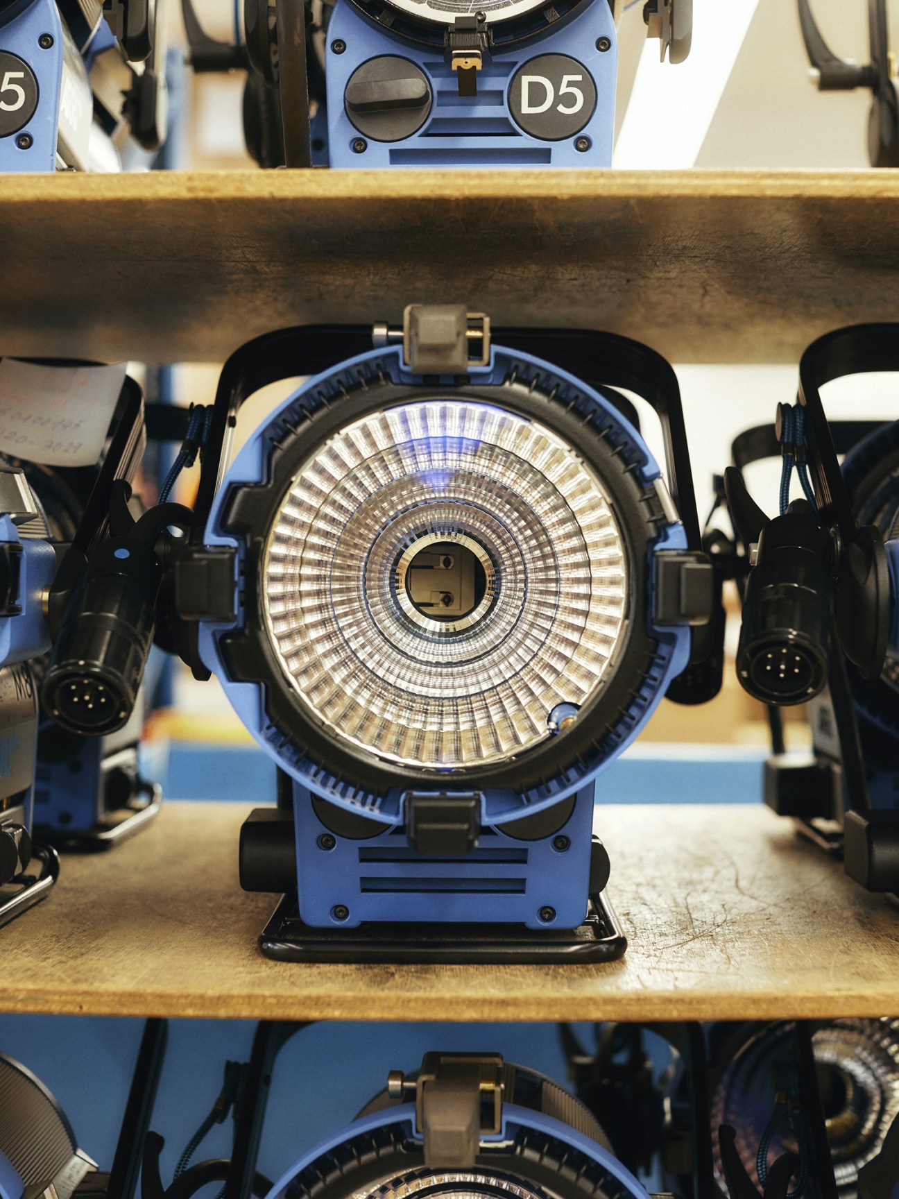 Close-up of an Arri D5 cinema lighting fixture showing its internal light source and reflective components.