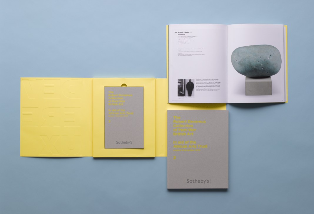 Sotheby's auction catalogue with yellow and grey covers featuring sculptural artwork displayed on blue background.