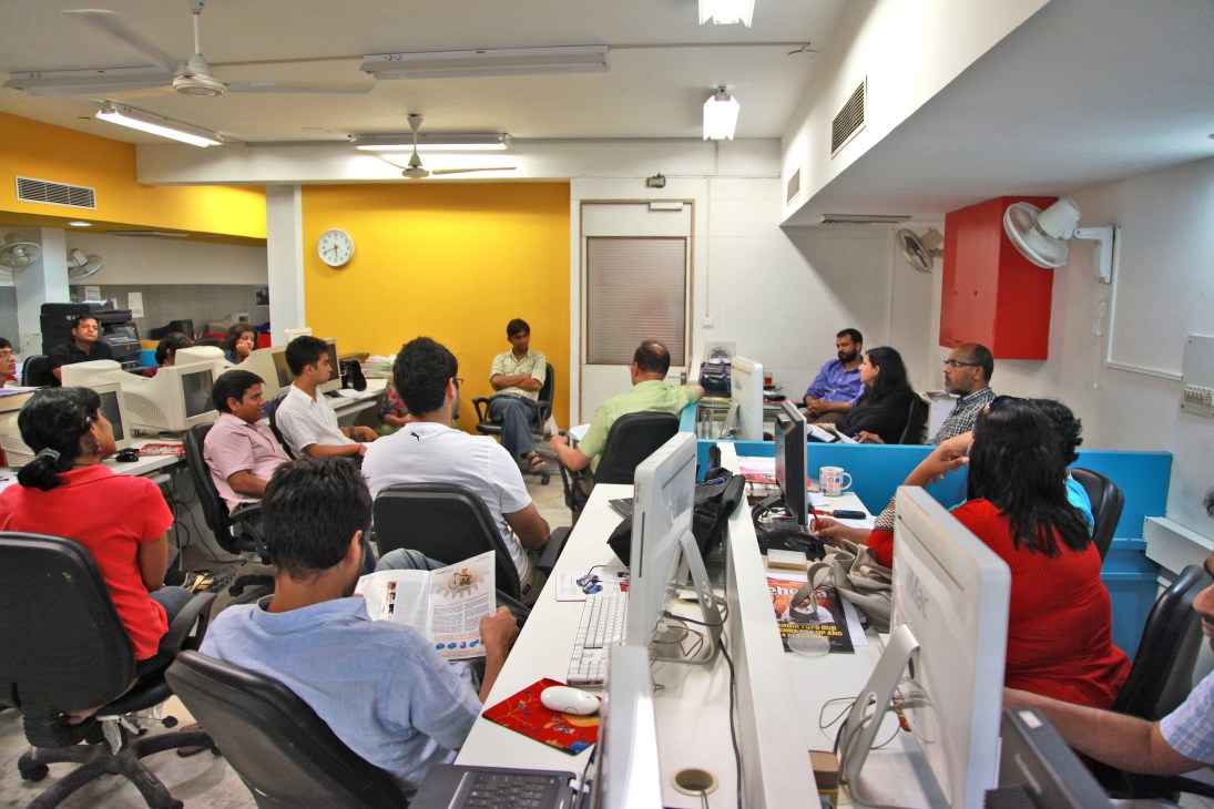 Tehelka staff gathered in a newsroom during a general meeting discussion.