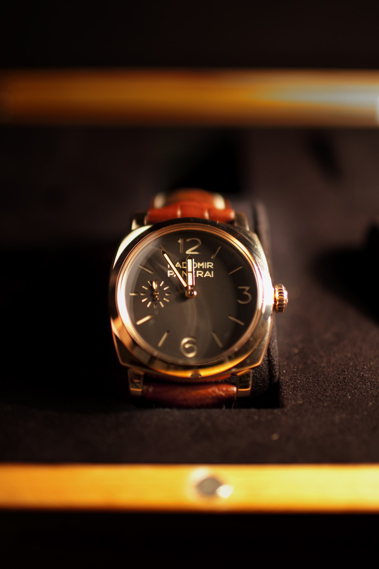 Panerai Radiomir 1940 luxury watch with red gold case and dark dial on leather strap