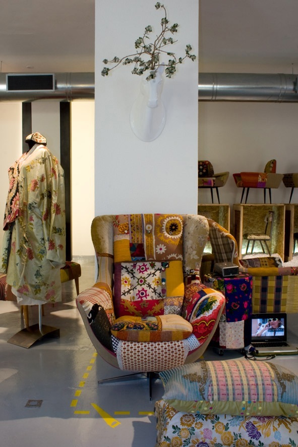 Colorful patchwork armchair with various fabric patterns displayed in Bokja's Beirut showroom.
