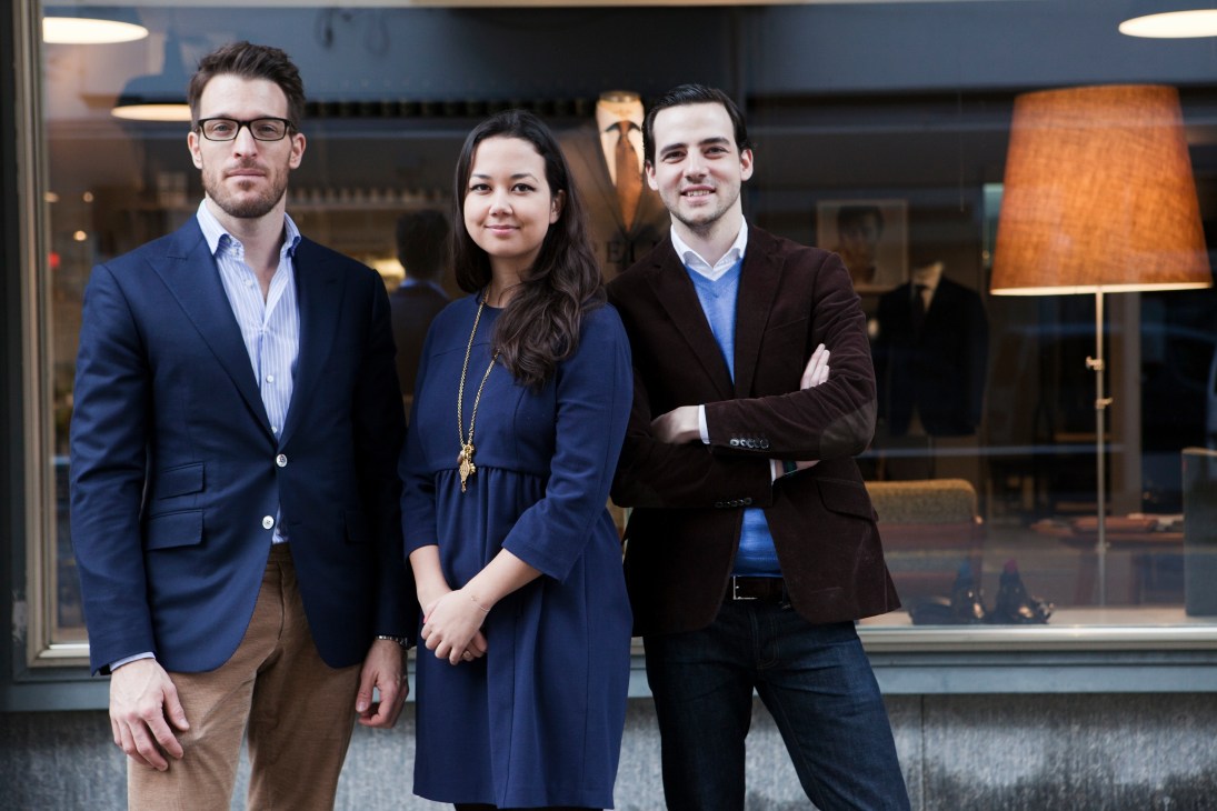 Three people posing outside Pelikamo store in Zürich, featuring co-owner Mia Zeltner with co-founders Christian Hunziker and Sebastiaan Vadasz.