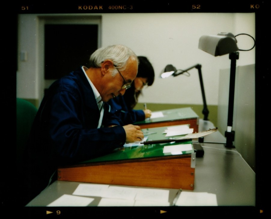 Yasuo Ebisu, a 62-year-old font designer, hunches over his worktable sketching kanji characters on graph paper under a desk lamp.