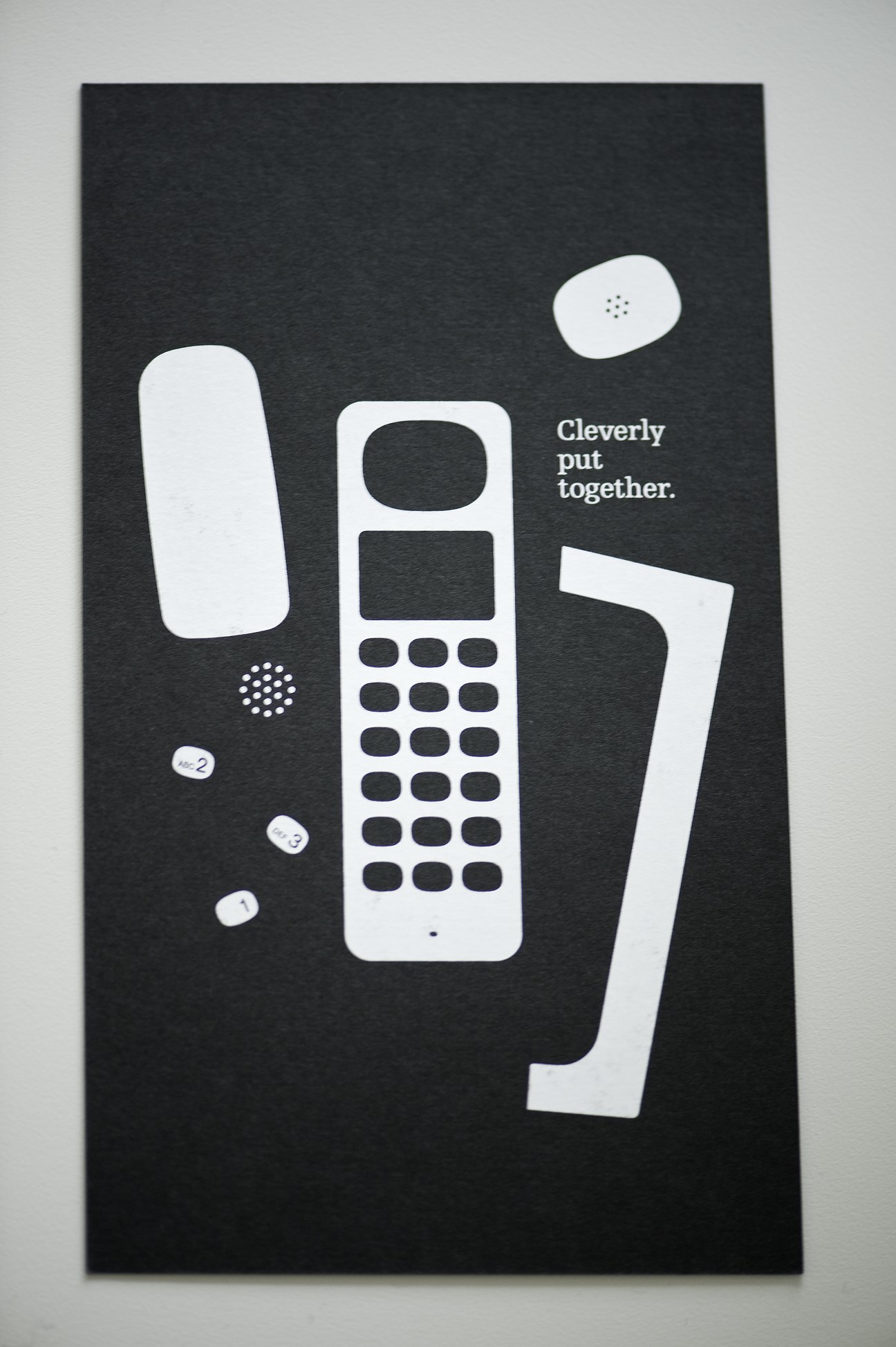 Punkt brochure showing DP 01 cordless phone components with tagline 'Cleverly put together' on black background.