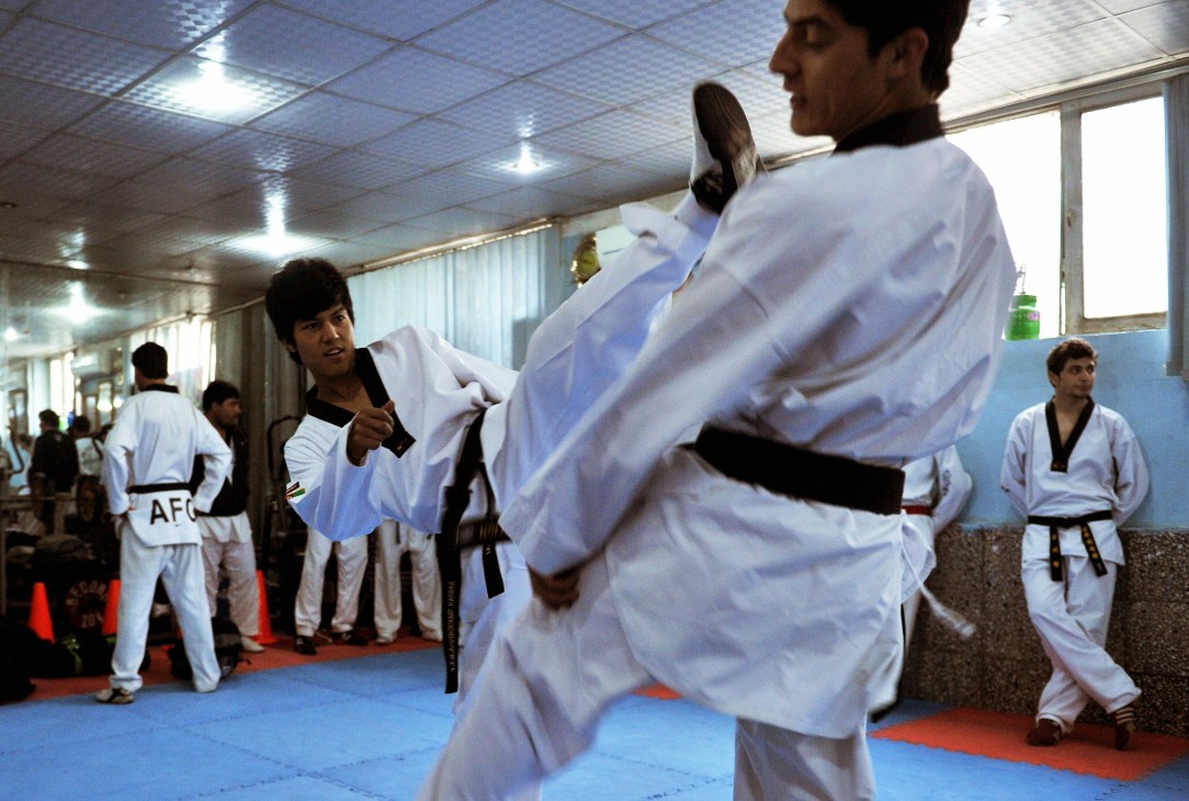 Rohullah Nikpai performs a high kick during taekwondo training at the National Olympic Committee centre in Kabul.