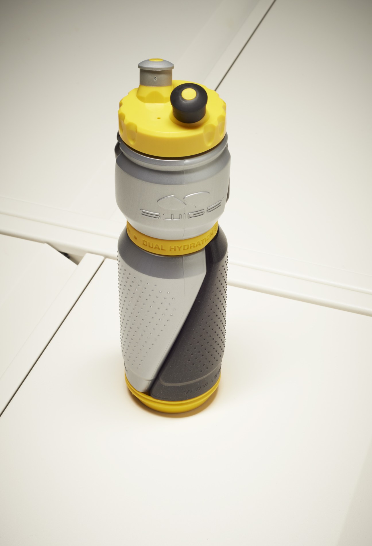 Swigz Extreme Hydration water bottle with dual chambers in yellow, white and gray colors.