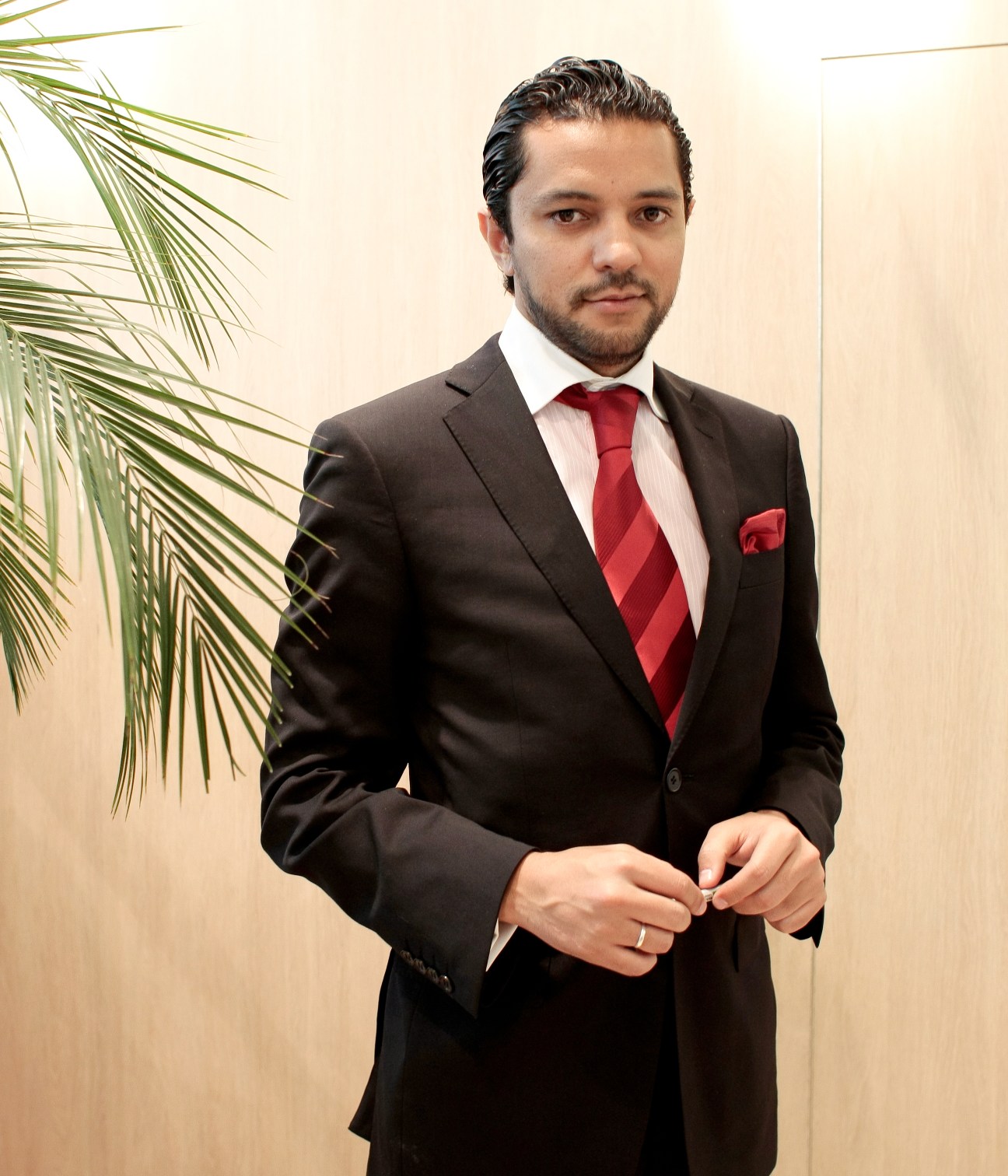 Issam Laasal, export director at Genpharma, wearing a dark suit with red tie