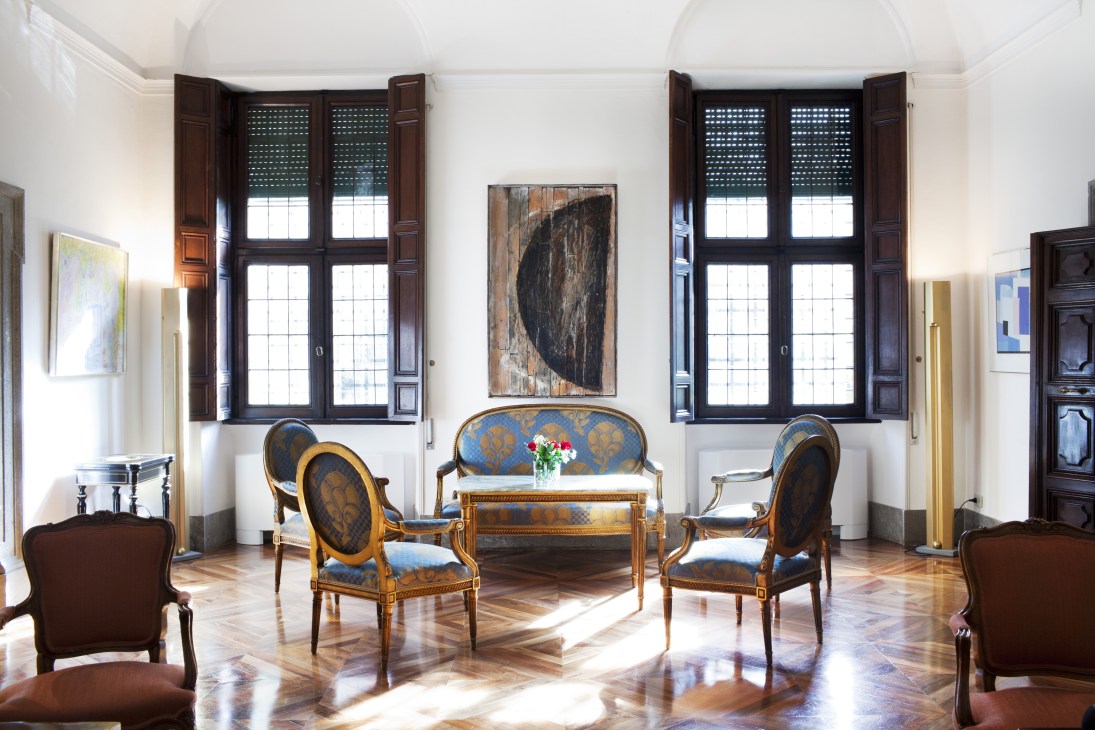 Elegant sitting room at the Finnish ambassador's residence in Rome with period furniture, artwork, and tall windows.