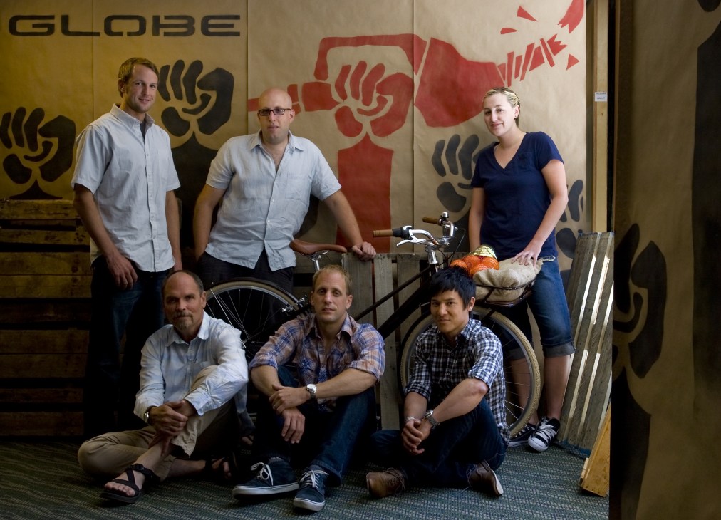 Six members of the Globe bike design team pose with a cargo bicycle in their California office.