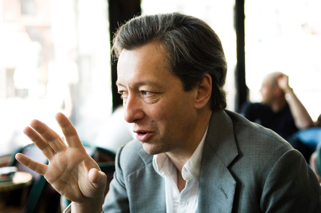 Frédéric Malle, a perfumier, gestures while speaking at Café de Flore in Paris.