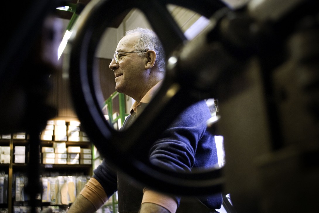 Third-generation cobbler Ermanno Alvisi working at his shop in Milan.