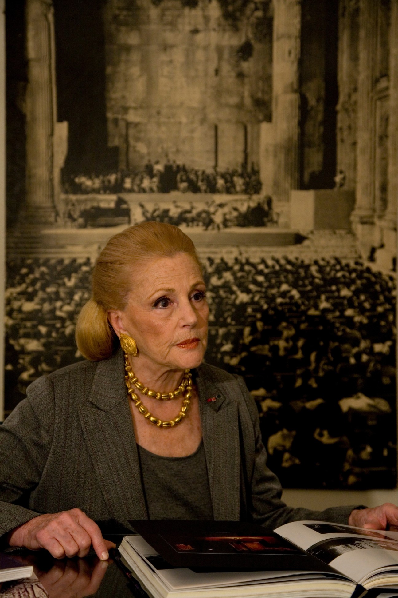 May Arida sits at her desk in the festival office, with a photograph of the Leipzig Philharmonic visible behind her.