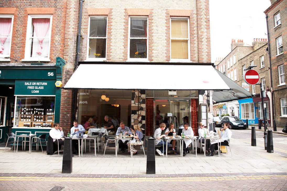 Diners seated at tables outside Cigala Spanish restaurant on Lamb's Conduit Street in Bloomsbury.