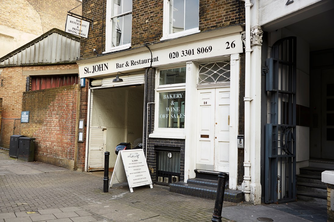 St John Bar & Restaurant storefront in Smithfield, east London, with brick exterior and signage for bakery and wine off-sales.