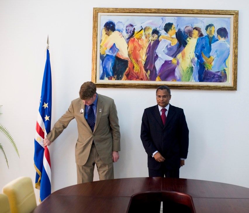 US congressman Patrick Kennedy and Cape Verde Prime Minister José Maria Neves stand in an official room with an American flag and framed artwork.