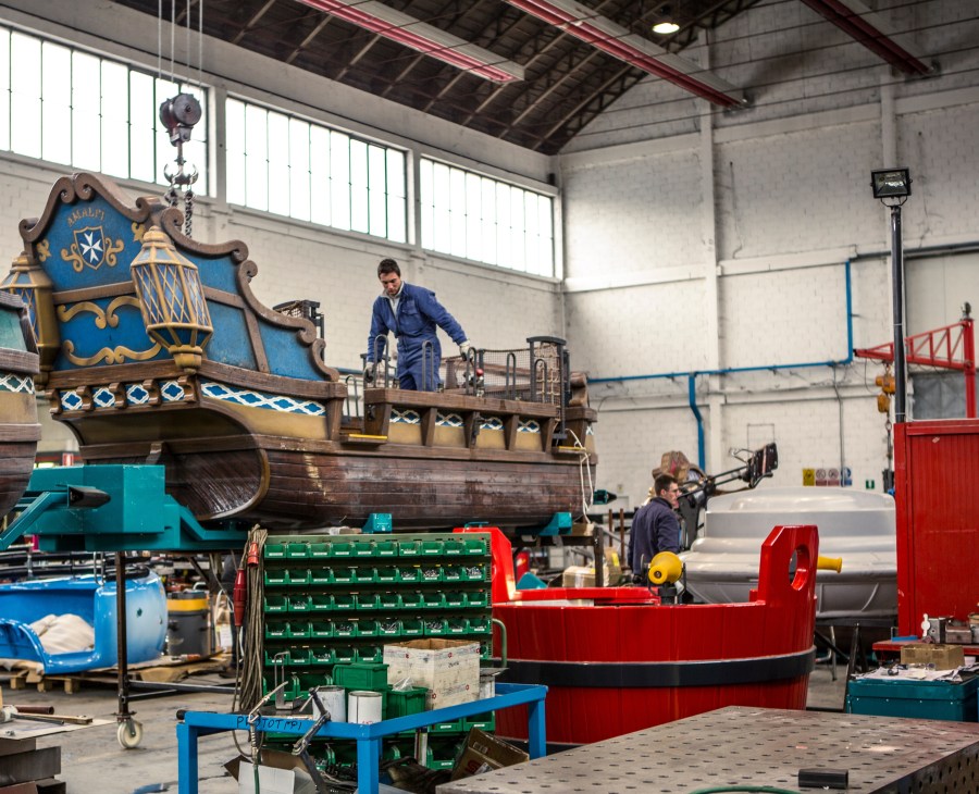 Workers assemble Zamperla's Water Fight pirate ship ride in the factory workshop