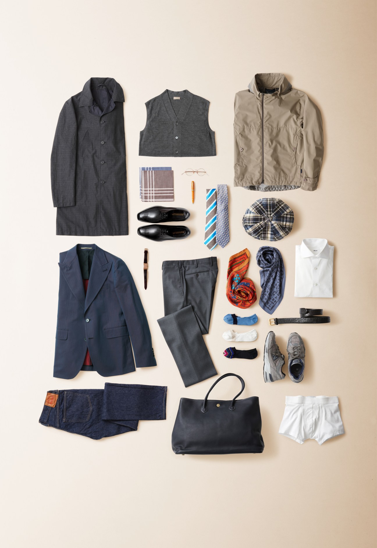 Flat lay of curated menswear items including blazer, coat, vest, trousers, shoes, ties, scarves, accessories and bag.