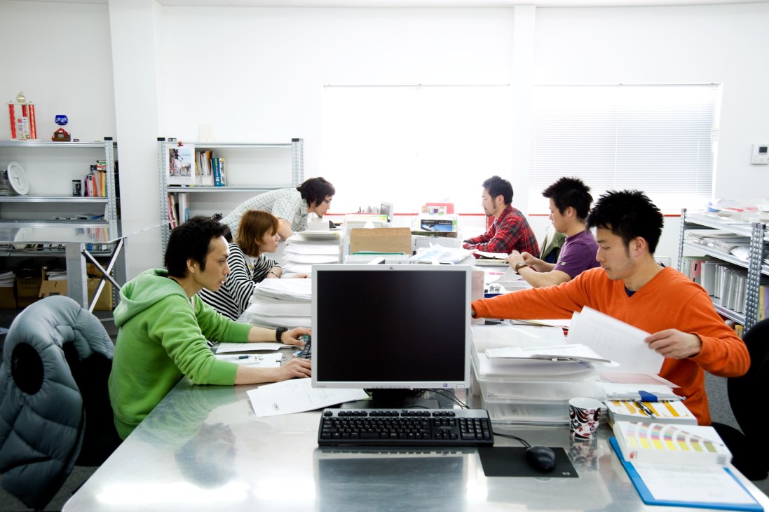 The Diatech Products office workspace in Uji, near Kyoto, with team members at desks and shelving.