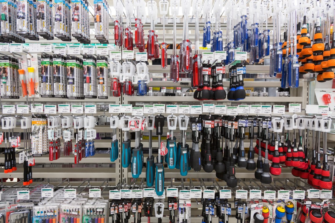 Wall display of screwdrivers in various sizes and colors at Tokyu Hands store