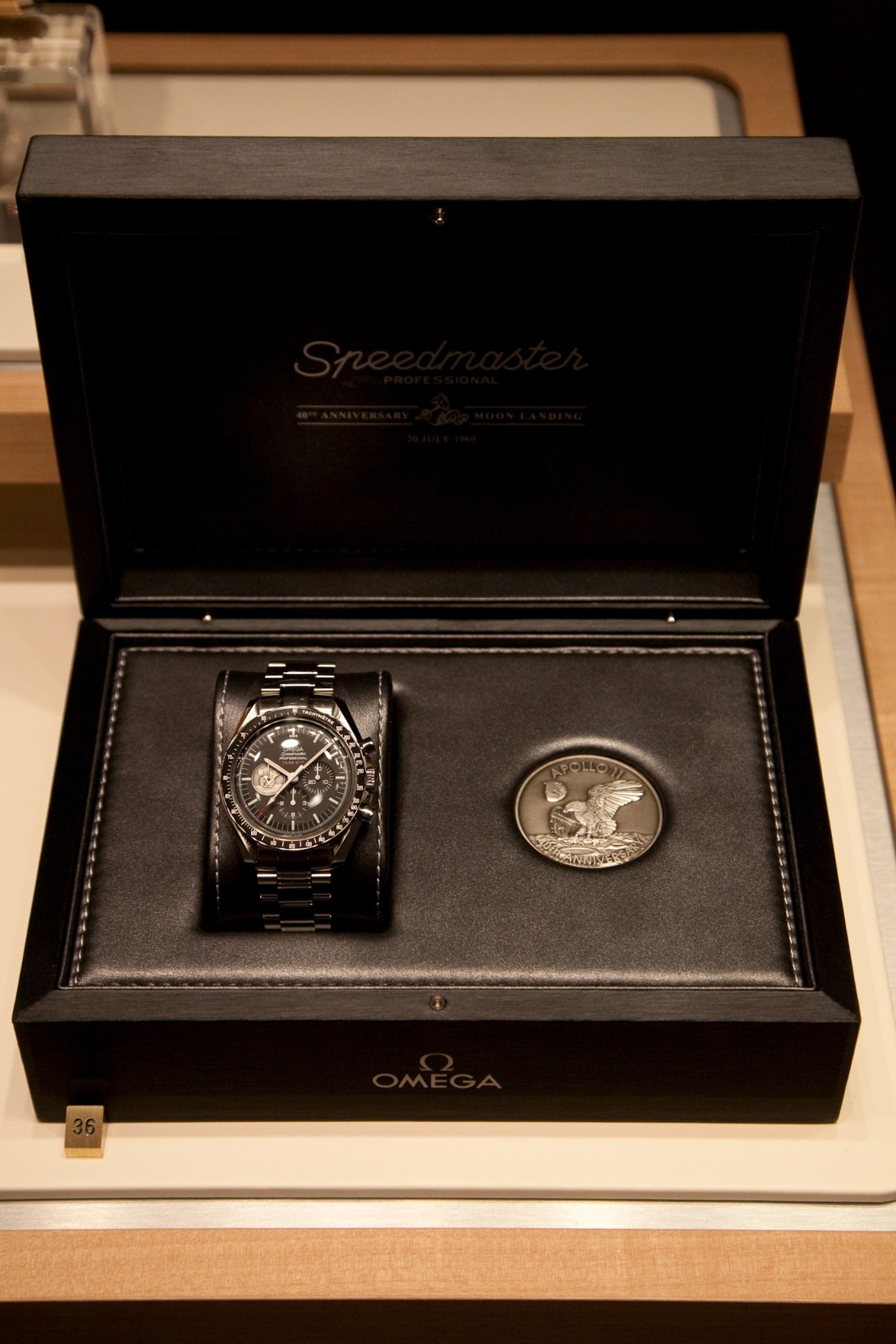 Omega Speedmaster 40th anniversary re-edition watch in presentation box with commemorative medal.