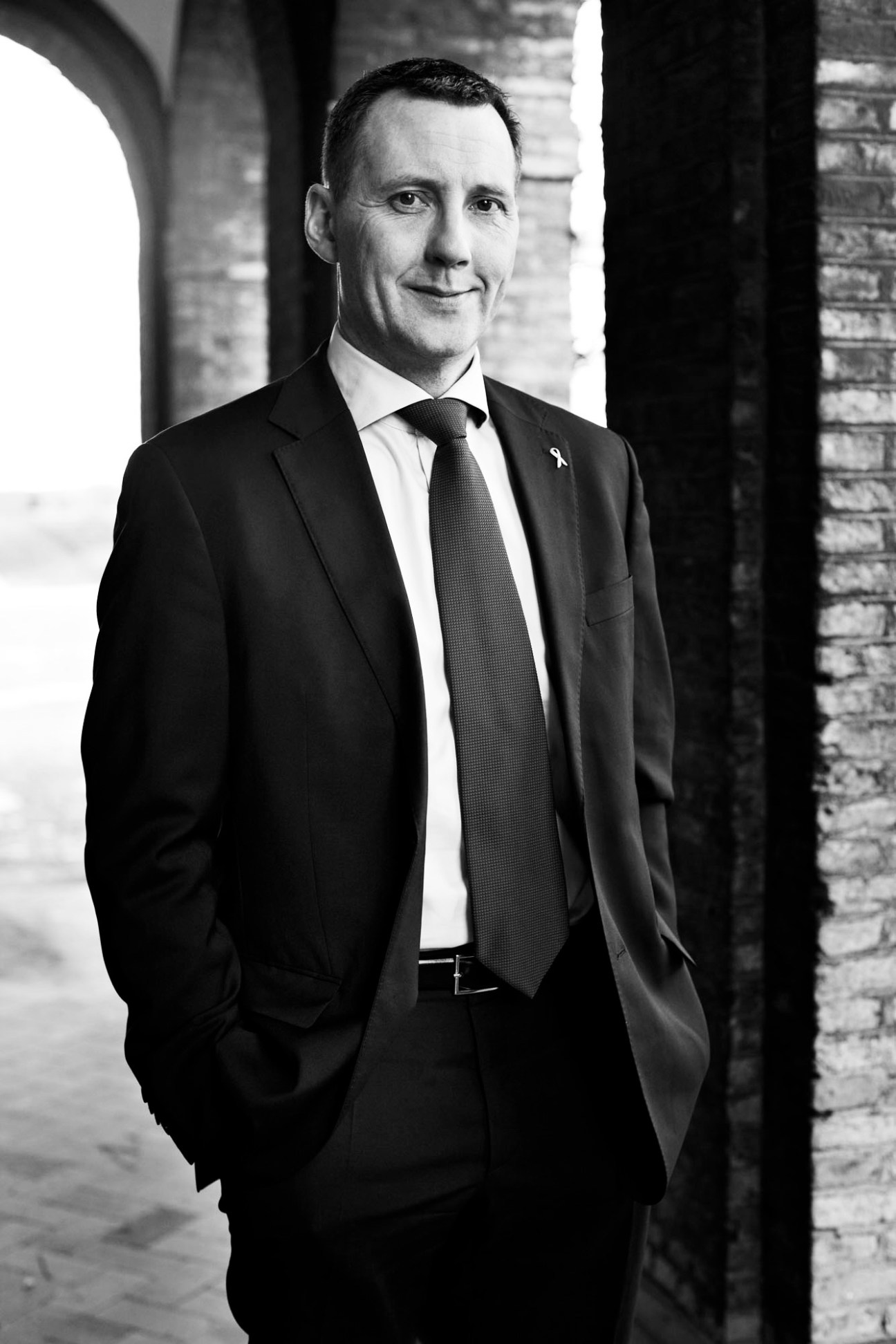 Black and white portrait of Nick Haekkerup, Denmark's defence minister, in a formal suit and tie.