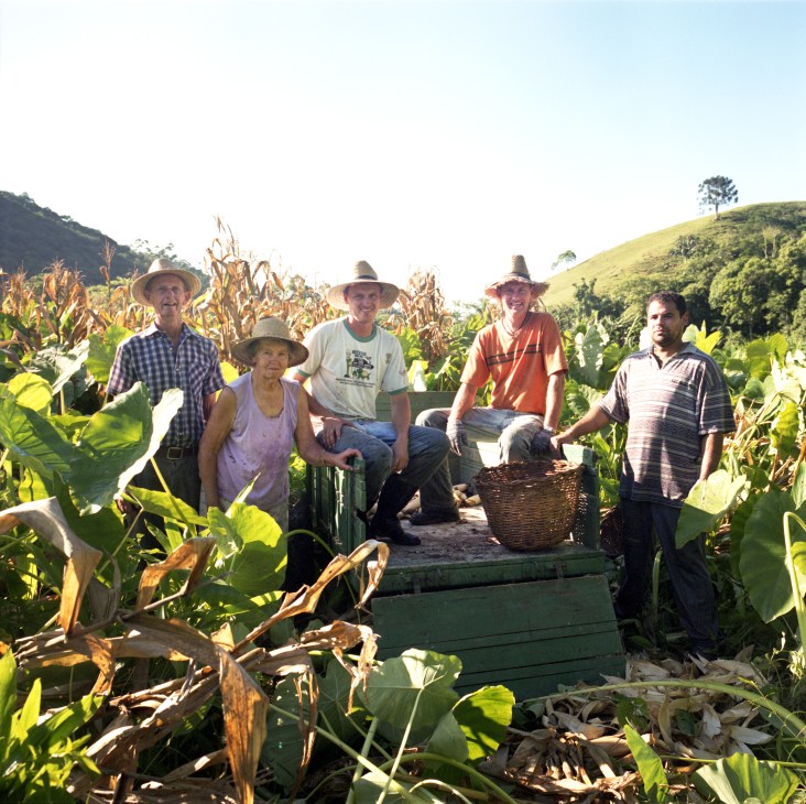 The Siewert family poses with harvested corn in a field in Pomerode, Brazil.