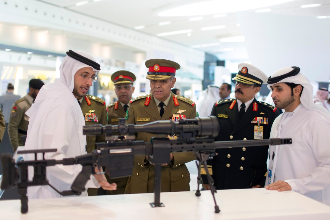 Bahrain defence force chief of staff Lt Gen Dhiab bin Saqr Al Nuaimi examines weapons at Idex exhibition.