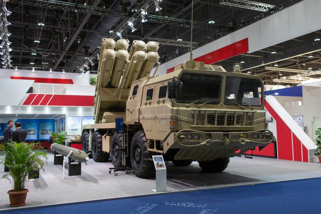 Norinco's AR3 multiple-rocket-launch system displayed on a tan military truck at a defence exhibition.