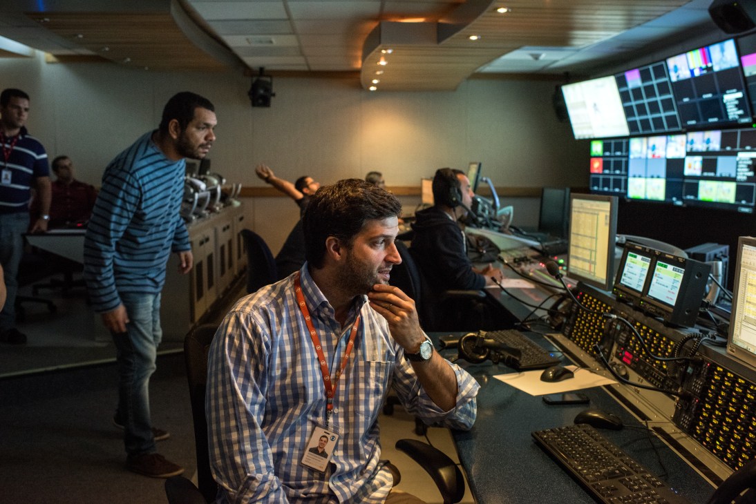Afonso Garschagen, editor in chief of Globo Esporte, directs a sports programme from the broadcaster's control room.