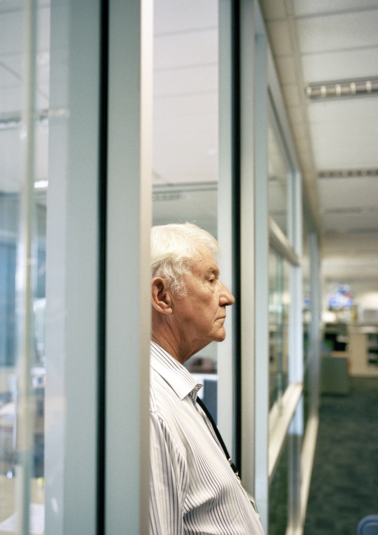 Group editor Rob Cronin surveying the editorial floor from his glass-walled office.