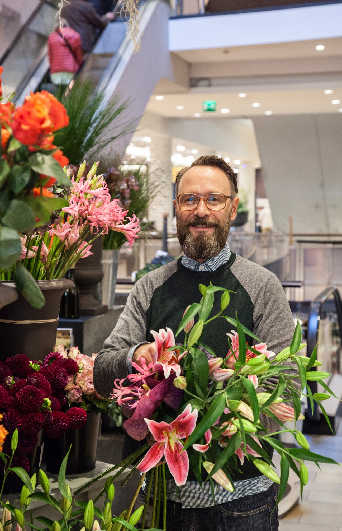 Stefan Fadenholz arranging colorful flowers in Engelhorn's I Fiori flower shop.