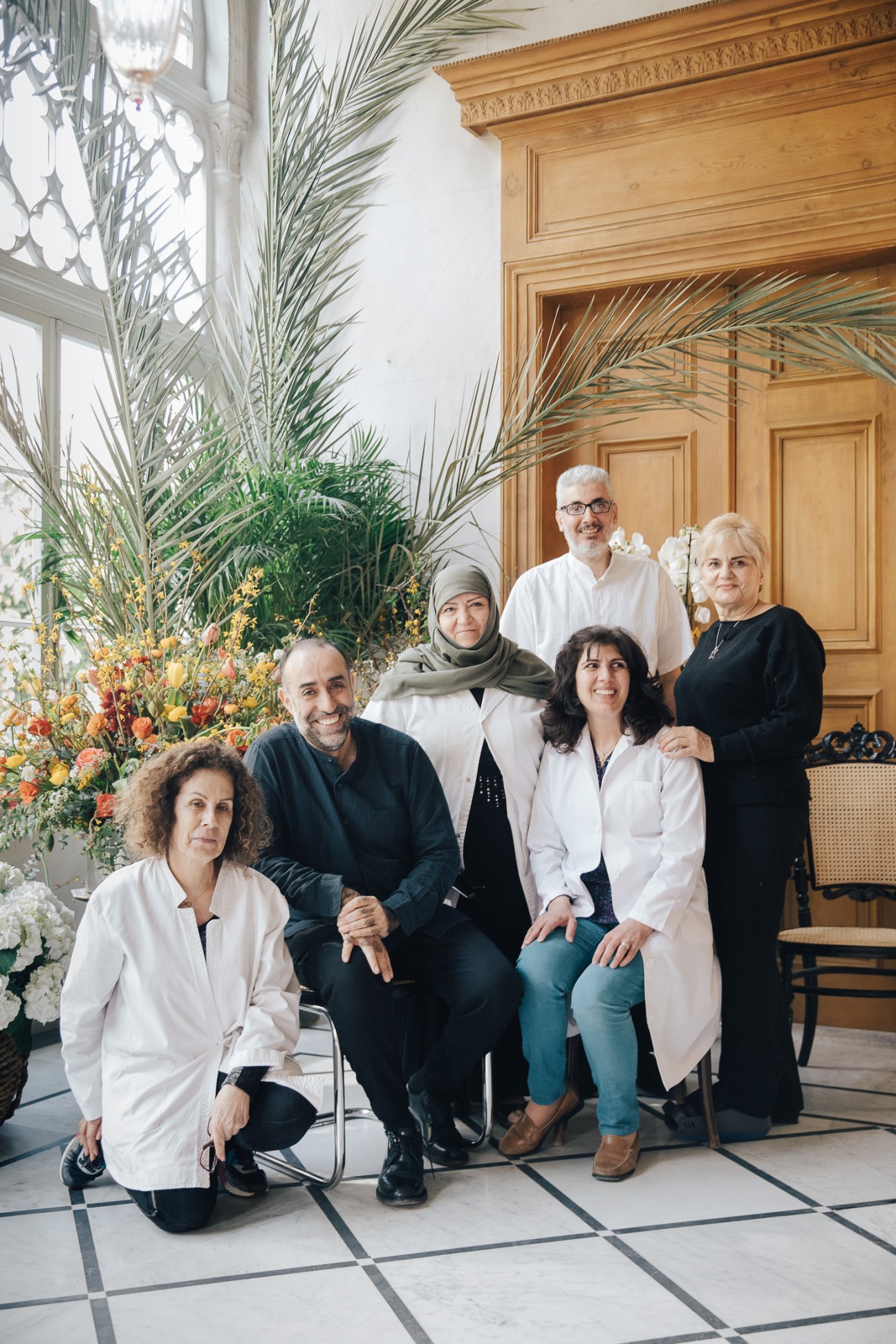 Designer Rabih Kayrouz and his five-person team posed in the elegant 19th-century mansion housing his Beirut boutique.